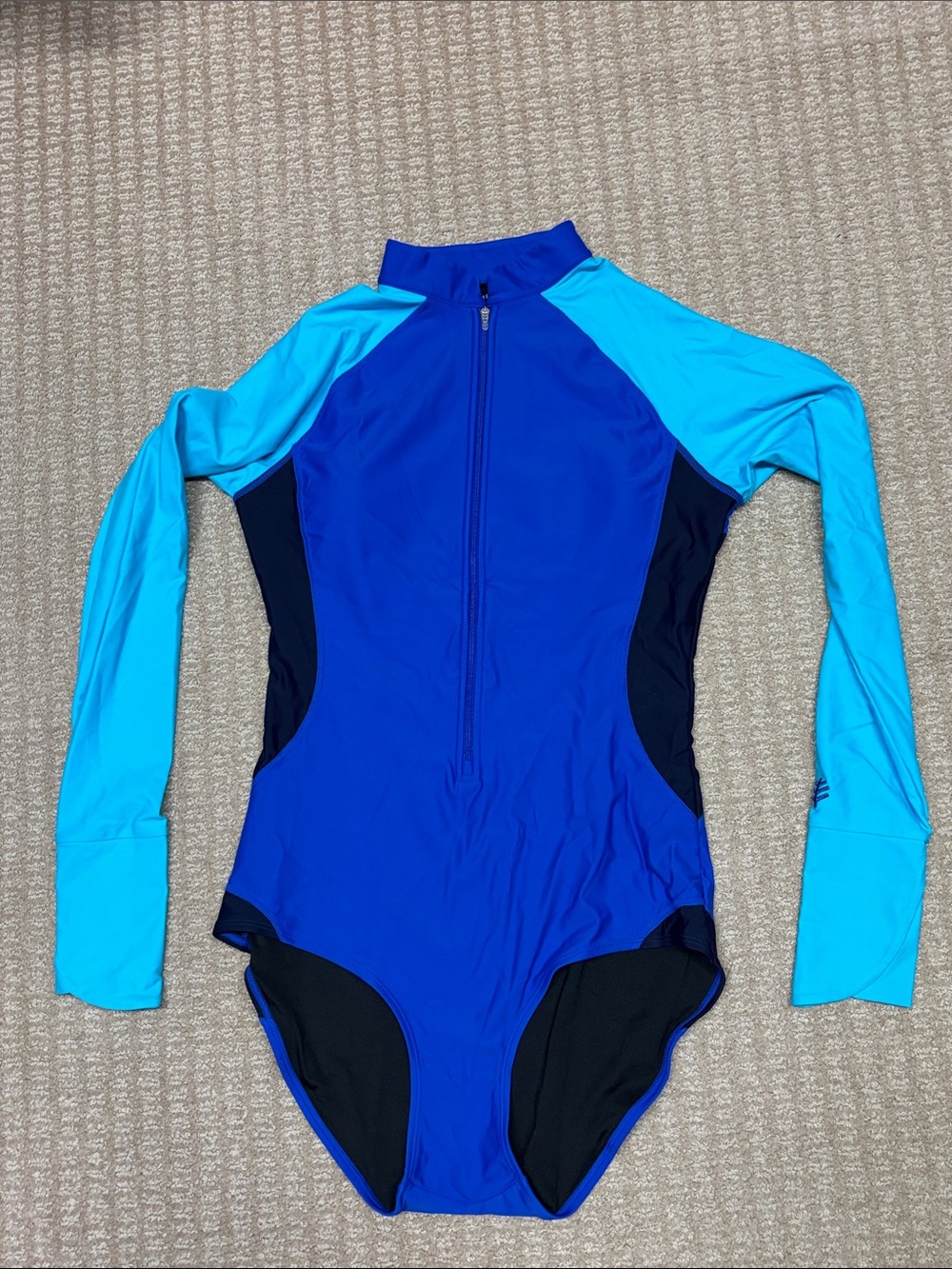 Coolibar One Piece Women’s solar protection long-sleeved swimsuit